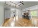 Open-concept living space featuring hardwood floors, a modern kitchen, and a staircase leading to the upper level at 733 Holding Ridge Ct, Wake Forest, NC 27587