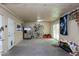 Spacious basement with a door to outside, stainless steel refrigerator and ample storage space at 831 Healey Ln, Durham, NC 27705