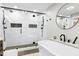 Elegant bathroom featuring a glass walk-in shower and modern standalone tub at 831 Healey Ln, Durham, NC 27705