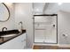 Elegant bathroom featuring a granite countertop, modern vanity, and glass shower at 831 Healey Ln, Durham, NC 27705