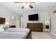 Beautiful main bedroom with a ceiling fan, stylish furnishings, and serene décor at 831 Healey Ln, Durham, NC 27705