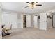 Large bonus room with multiple storage closets, neutral paint, a ceiling fan, and carpeted floors at 831 Healey Ln, Durham, NC 27705