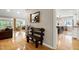 Bright foyer with hardwood floors, leading to the kitchen, living room and entry at 831 Healey Ln, Durham, NC 27705