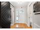 Bright foyer with hardwood floors, a decorative sliding barn door and plenty of light at 831 Healey Ln, Durham, NC 27705