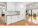 Modern kitchen with granite counters, ample cabinet space, and a view into the adjoining living spaces at 831 Healey Ln, Durham, NC 27705