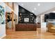 Open living area showcasing hardwood floors, fireplace, and modern staircase at 831 Healey Ln, Durham, NC 27705