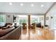 Spacious living room with hardwood floors, a fireplace, and multiple seating areas at 831 Healey Ln, Durham, NC 27705