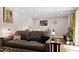 Cozy living room with a comfortable couch, side tables, and decorative pillows at 831 Healey Ln, Durham, NC 27705