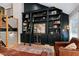 Living room with built-in shelves, and a staircase at 831 Healey Ln, Durham, NC 27705