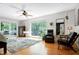 Bright main bedroom with hardwood floors and a large window with scenic outside views at 831 Healey Ln, Durham, NC 27705