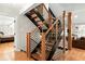 Modern staircase with metal railings and wooden steps, connecting the home's multiple levels with style at 831 Healey Ln, Durham, NC 27705