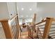 Modern staircase with wooden and metal railings, leads up from the lower level at 831 Healey Ln, Durham, NC 27705