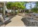 Outdoor wooden deck and brick patio with shaded pergola for relaxation and entertaining at 8805 Mourning Dove Rd, Raleigh, NC 27615
