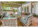 Charming brick patio with outdoor seating area and pergola, perfect for entertaining at 8805 Mourning Dove Rd, Raleigh, NC 27615