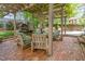Inviting outdoor patio area with fire pit and comfortable seating under a pergola at 8805 Mourning Dove Rd, Raleigh, NC 27615