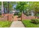 Charming two-story home with black shutters, a brick foundation, a brick walkway, and a gazebo at 8805 Mourning Dove Rd, Raleigh, NC 27615