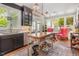 Modern kitchen with black cabinets, stainless steel appliances, and a stylish kitchen island with a butcher block top at 8805 Mourning Dove Rd, Raleigh, NC 27615