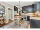Modern kitchen features stainless steel appliances, dark cabinetry, and a stylish kitchen island at 8805 Mourning Dove Rd, Raleigh, NC 27615