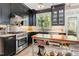 Modern kitchen features stainless steel appliances, dark cabinetry, and a stylish kitchen island at 8805 Mourning Dove Rd, Raleigh, NC 27615
