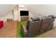 Attic living room with comfortable seating and modern amenities, perfect for relaxation at 8805 Mourning Dove Rd, Raleigh, NC 27615
