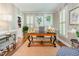 Charming office featuring a wooden desk, plantation shutters, and striped wallpaper at 8805 Mourning Dove Rd, Raleigh, NC 27615