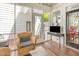 Comfortable screened porch with chair, coffee table, and outdoor views at 8805 Mourning Dove Rd, Raleigh, NC 27615