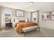 Cozy main bedroom featuring a king-size bed, neutral tones, and ample natural light at 900 Emmer St, Rolesville, NC 27571