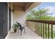 Cozy balcony with wood flooring, railing and a chair and plant at 97302 Dobbs, Chapel Hill, NC 27517