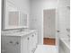 Bathroom showcasing modern vanity with a marble countertop and a tiled bath/shower at 97302 Dobbs, Chapel Hill, NC 27517