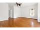 Spacious bedroom with hardwood floors, a ceiling fan, and two windows at 97302 Dobbs, Chapel Hill, NC 27517