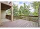 Spacious deck with wood flooring and railing, offering scenic views of the surrounding trees at 97302 Dobbs, Chapel Hill, NC 27517