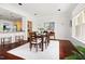 Spacious dining room with hardwood floors, natural light, and an open layout to the kitchen and other living spaces at 97302 Dobbs, Chapel Hill, NC 27517