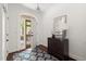 Bright foyer featuring hardwood floors, a patterned rug, entry table, and an open doorway with a view to the outside at 97302 Dobbs, Chapel Hill, NC 27517
