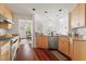 Bright kitchen with stainless steel appliances, ample counter space, and natural light with a view to dining area at 97302 Dobbs, Chapel Hill, NC 27517
