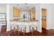 Kitchen counter with barstool seating with modern appliances and fixtures and plenty of natural light at 97302 Dobbs, Chapel Hill, NC 27517