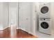 Laundry area showcasing a stacked washer and dryer set at 97302 Dobbs, Chapel Hill, NC 27517