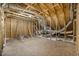 Exposed attic framing with plywood, insulation, and supports at 1008 Peedin Rd, Selma, NC 27576