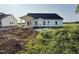Backyard view of a charming single-Gathering home with lush green lawn at 1008 Peedin Rd, Selma, NC 27576