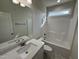 Bathroom featuring vanity sink, tub, and modern fixtures at 1008 Peedin Rd, Selma, NC 27576