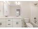 Bathroom with a double sink vanity and a shower tub combo with brushed nickel fixtures at 1008 Peedin Rd, Selma, NC 27576