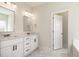 Bathroom showcasing a double vanity, quartz countertop, matte black hardware and stylish tile flooring at 1008 Peedin Rd, Selma, NC 27576