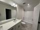 Bright bathroom with a shower and tub combination, vanity, and a new toilet at 1008 Peedin Rd, Selma, NC 27576