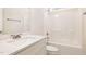 Bathroom with a single sink vanity and a shower tub combo with modern fixtures at 1008 Peedin Rd, Selma, NC 27576