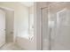 Bright bathroom featuring a soaking tub, glass shower, and neutral color palette at 1008 Peedin Rd, Selma, NC 27576