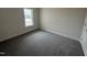 Cozy bedroom with neutral carpet and a window offering natural light at 1008 Peedin Rd, Selma, NC 27576