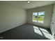 Neutral bedroom with carpet and a window looking out onto a rural landscape at 1008 Peedin Rd, Selma, NC 27576