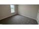 This bedroom has a neutral paint color and soft carpeting at 1008 Peedin Rd, Selma, NC 27576