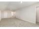 Spacious carpeted bonus room featuring several doors, outlets and natural lighting at 1008 Peedin Rd, Selma, NC 27576