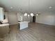 This kitchen has an open design, white cabinets, recessed lighting, stainless appliances and a center island at 1008 Peedin Rd, Selma, NC 27576
