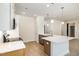 Open kitchen with pendant lights over a large island and stainless steel appliances at 1008 Peedin Rd, Selma, NC 27576